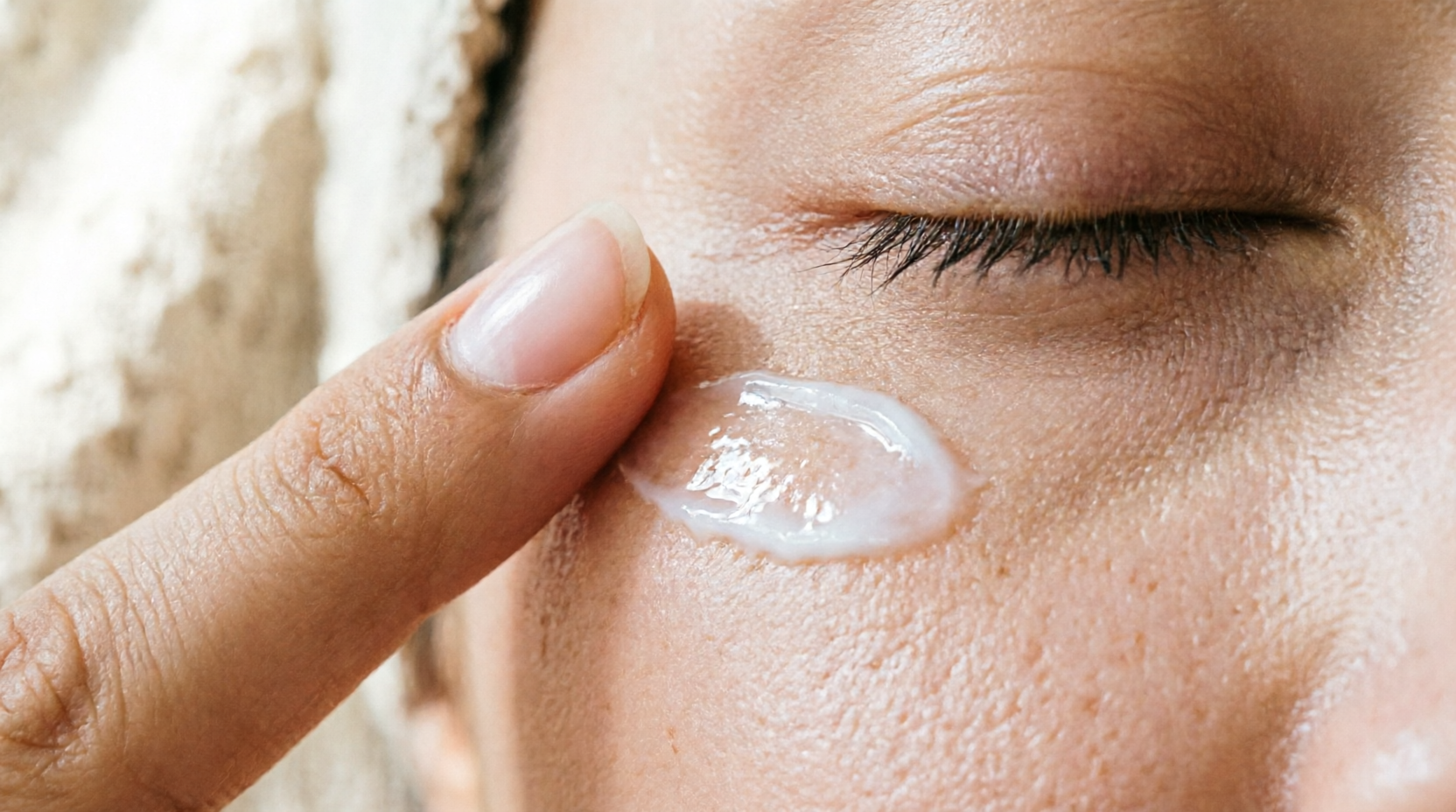 Close-up of eye cream being applied, relaxing skincare treatment