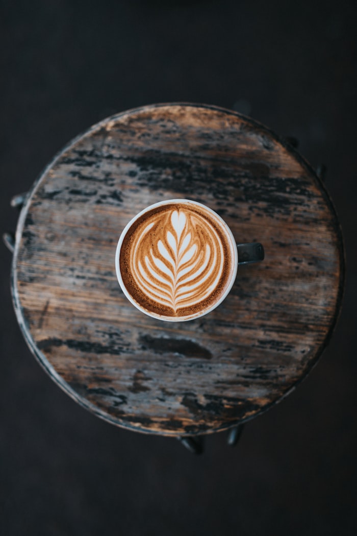 Top-down latte art on wood